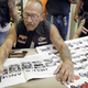 Sonny Barger, founder of the Oakland, California charter of the Hells Angels motorcycle club, autographs a copy of Post magazine during an event at a Harley-Davidson motorcycle dealership August 23, 2003 in Quincy, Illinois.
